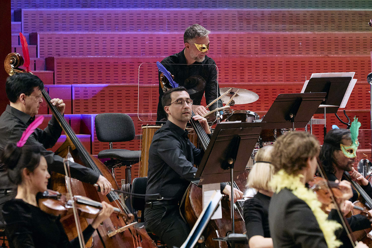 Musicians at the Orchestre de la Suisse Romande during the family concert “Le Carnaval d'Aldo” dressed with carnival accessories on the stage of Geneva's Victoria Hall.